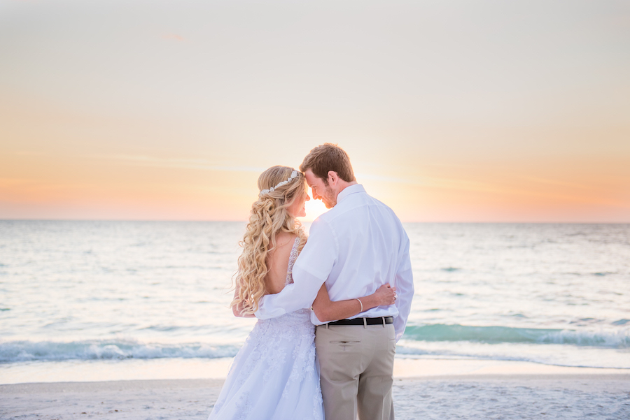 Sunset Bride and Groom Wedding Portrait in Ivory Wedding Dress with Tulle and Embroidery with Beachy Wedding Hair with Crystal Headband and Groom in Khaki Pants | Tampa Wedding Hair and Makeup Artist Michele Renee The Studio | Tampa Wedding Photographer Kera Photography