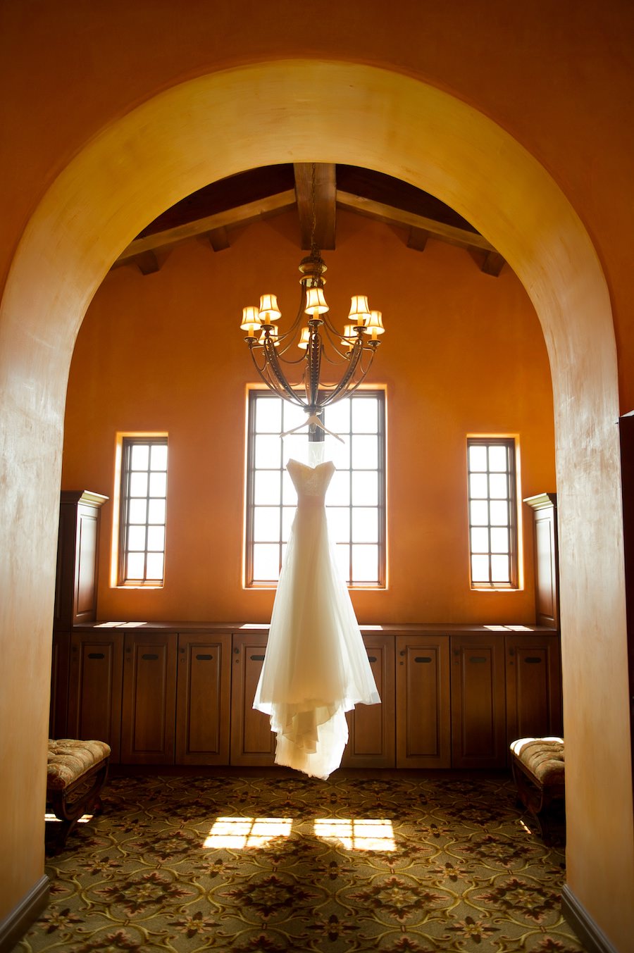Getting Ready Details: Wedding Dress Hanging from Chandelier | Tampa Bay Wedding Photographer Andi Diamond Photography