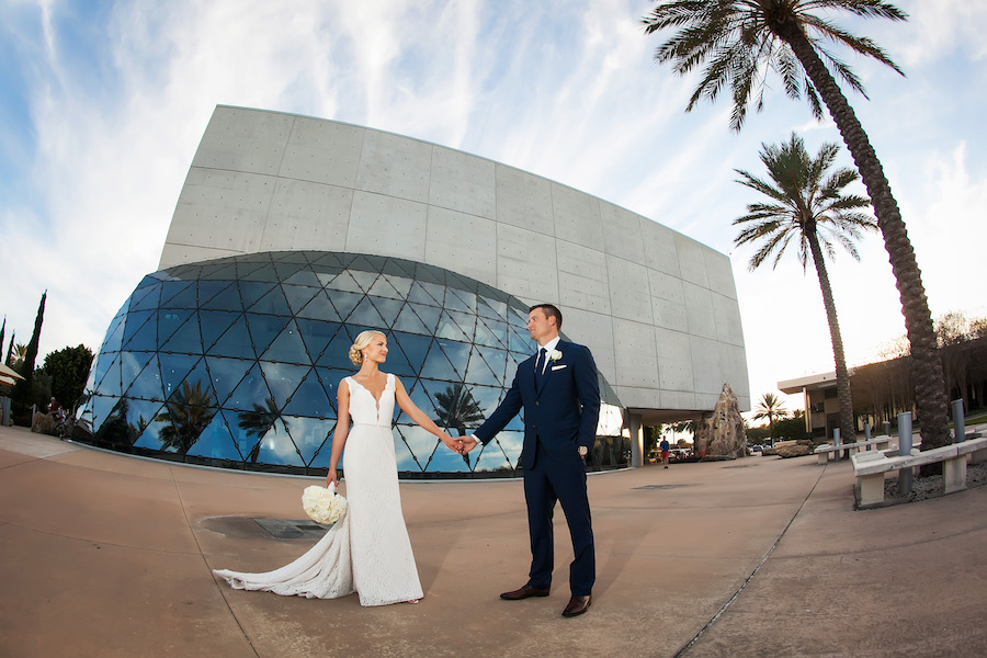 St. Pete Bride and Groom Wedding Portrait in Navy Blue Suit and Ivory Mikaella Wedding Dress | Downtown St. Pete Wedding Venue Mahaffey Theater | Photographer Limelight Photography | Wedding Planner Exquisite Events