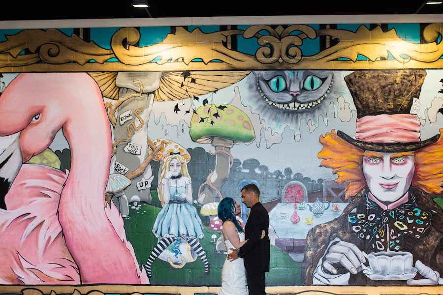 Alice in Wonderland Graffiti Art Mural Wedding Portrait in Downtown St. Pete | Whimsical Fairytale Wedding Inspiration| St. Petersburg Wedding Planner UNIQUE Weddings & Events