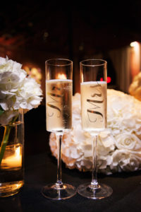 Mr. and Mrs. Champagne Flutes with Ivory Rose Bouquet | St. Pete Wedding Photographer Limelight Photography
