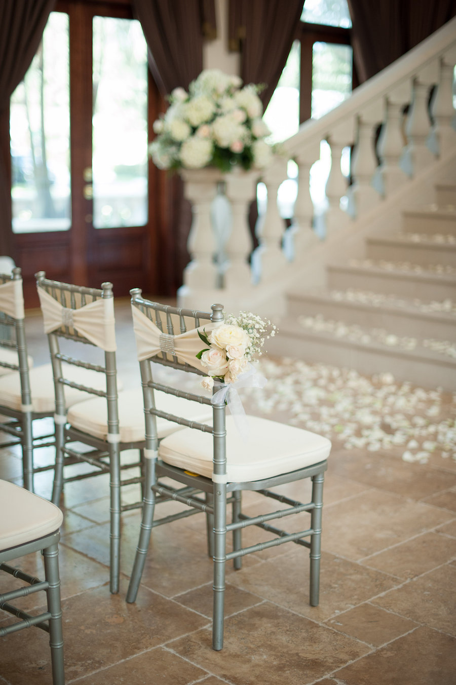 Indoor, Private Residence Wedding Ceremony with Silver Chiavari Chairs and Ivory Flower Petals
