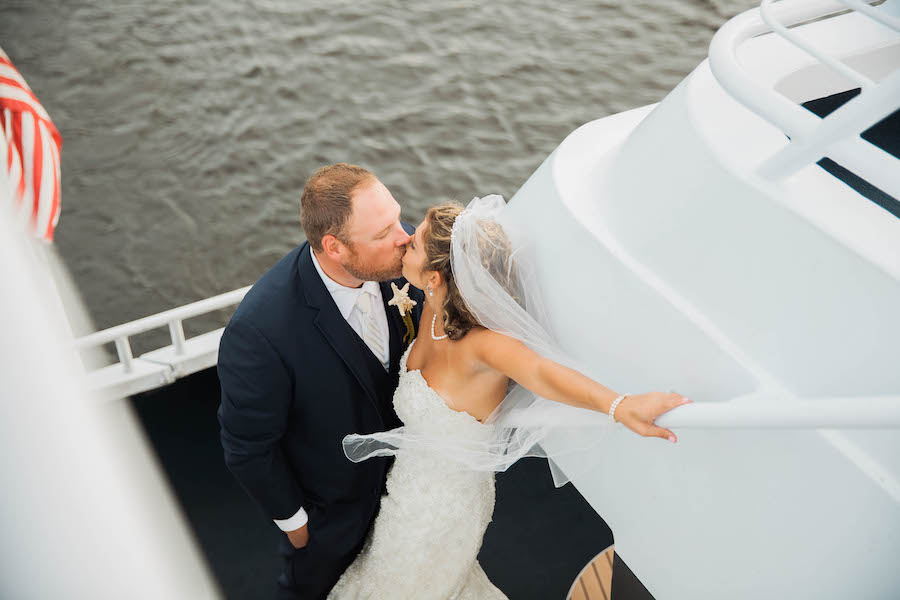 Outdoor Tampa Bridal Wedding Portrait in Sweetheart Lace and Beaded Wedding Dress with Veil | Bride and Groom Wedding Portrait aboard Yacht StarShip Wedding Venue