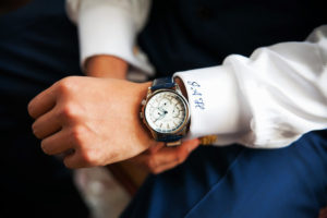 Groom in Navy Blue and White Monogrammed Suit and Navy Watch