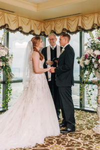 Bride and Groom During Wedding Ceremony at The Tampa Club with Tampa Officiant DeArruda Weddings