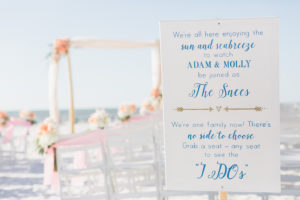 Florida beach wedding ceremony decor | Beach-themed ceremony sign | Blush and ivory ceremony flowers | Hilton Clearwater Beach