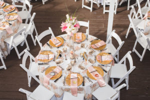 Ivory, Pink and Gold Floral Beach Inspired Wedding Reception Tables With Tall Pink Centerpieces, Satin Napkins and Gold Chargers | Wedding Tablescape Ideas & Inspiration | Outdoor Waterfront Hotel Wedding Venue Hilton Clearwater Beach | Rentals A Chair Affair