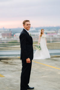 Groom with Bride in Background Wedding Portrait at The Tampa Club Wedding Venue