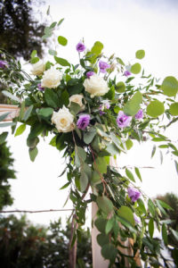 Sarasota Wedding Ceremony Ivory and Purple Roses with Greenery Arch