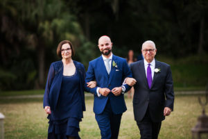 Outdoor Sarasota Groom Walking Down Aisle with his Parents