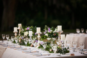 Ivory, Purple and Greenery in Silver Vase with White Candles | Wedding Reception Decor and Inspiration