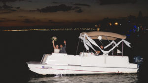 Waterfront Tampa Bay Wedding Exit on Boat | Tampa Bay Wedding Photographer Grind and Press Photography