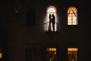 Sarasota Bride and Groom Nighttime Wedding Portrait on Balcony | Sarasota Wedding Photographer Marc Edwards Photographs Wedding Planner UNIQUE Weddings and Events