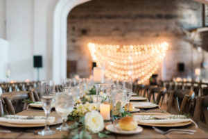 Rustic Wedding Reception with Gold and Ivory Centerpieces on Long Feasting Tables | Inspire Weddings and Events Tampa Wedding Planning