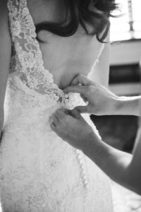 Bridal Getting Ready Wedding Portrait in a Backless Ivory Allure Beaded Sheath Wedding Dress with Back Button Closure | Sarasota Wedding Photographer Marc Edwards Photographs
