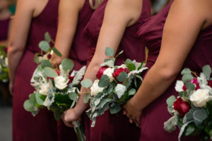 Burgundy Bridesmaid Dresses with White and Red Wedding Bouquets with Greenery