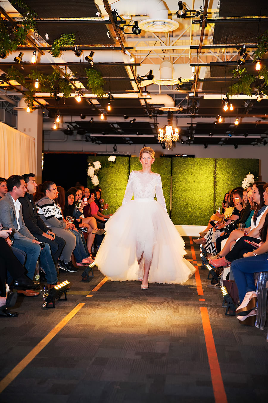 White Lace Alyne Lis High Low Wedding Dress | Marry Me Tampa Bay Wedding Week Bridal Fashion Runway Show | Tampa Bay Wedding Photographer Limelight Photography | Wedding Planner Glitz Events | Hair and Makeup Artist Michele Renee The Studio | Couture Wedding Dress Shop Isabel O'Neil Bridal