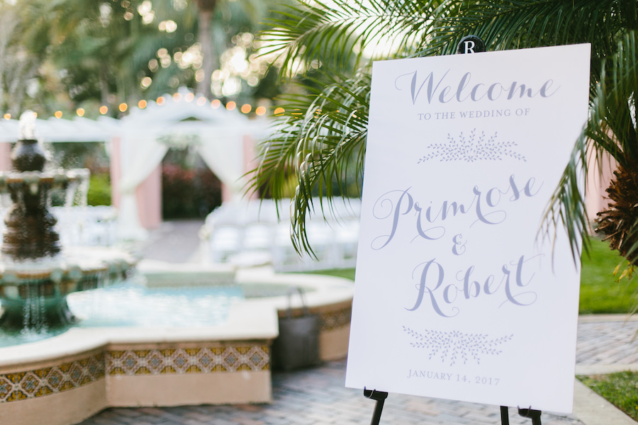 All White Wedding Ceremony Welcome Sign with Gray Calligraphy at St. Pete Wedding Ceremony Venue The Vinoy Renaissance