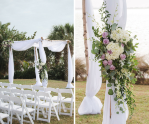 Beach Chic Outdoor Waterfront Wedding Ceremony with Wooden Wedding Arch Draped in White Chiffon with Ivory and Lavender Floral Arrangements | Sarasota Wedding Planner UNIQUE Weddings and Events | Photography by Marc Edwards Photographs