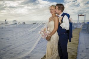 Outdoor, Tampa Bay Beach Bride and Groom Wedding Portrait | Outdoor Waterfront Hotel Wedding Venue Hilton Clearwater Beach