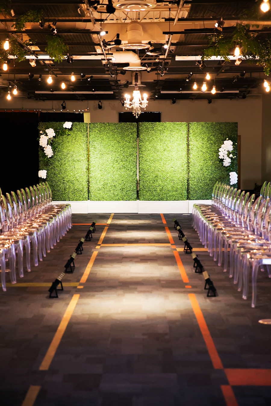 Modern Green Wedding Reception Inspiration & Ideas| Greenery Wall with Ghost Chairs and Hanging Chandeliers | Rentals A Chair Affair | Lighting Nature Coast Entertainment Services | Downtown Tampa Wedding Venue Glazer's Children Museum | Wedding Planner Glitz Events