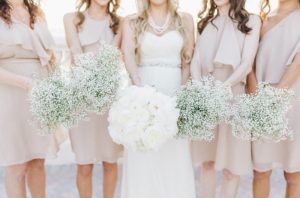 Bridal Party Wedding Portrait with White Wedding Bouquet and Pastel Nude Taupe Bridesmaids Dresses with Baby's Breath | Tampa Bay Hotel Wedding Venue Hyatt Clearwater Beach Regency
