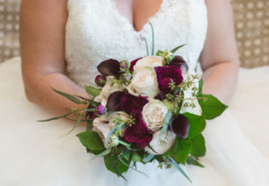 Bridal Wedding Portrait in Ivory Tulle and Lace Allure Wedding Dress with Ivory and Purple Rose Wedding Bouquet | Clearwater Beach Wedding Planning by Kimberly Hensley Events