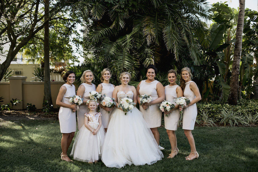 Outdoor Sarasota Wedding Portrait with Bride in Ivory Reem Acra Ballgown and Bridesmaids in Short Camilyn Beth Bridesmaid Dresses and Flower Girl in Pink Sequin and Tulle Ballgown | Wedding Venue Sarasota Yacht Club | Tampa Bay Wedding Planner NK Productions