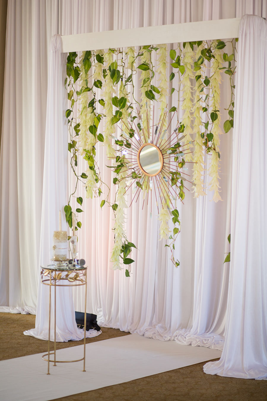 Elegant Wedding Ceremony Decor Altar White Draped Backdrop with Hanging Flowers, Greenery and Gold Mirror | Tampa Bay Wedding Photographer Brandi Image Photography | Planner Parties a la Carte