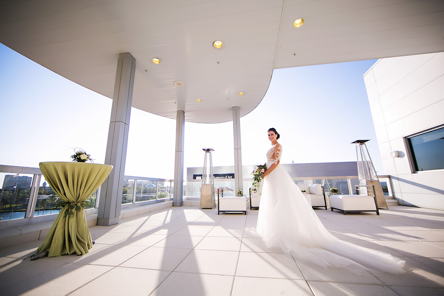 Rooftop Bridal Portrait in Nude Illusion Lace Wedding Dress with Sleeves | Tampa Bay Bridal Shop Isabel O'Neil Bridal | Wedding Photographer Limelight Photography | Downtown Tampa Venue Glazer's Children Museum