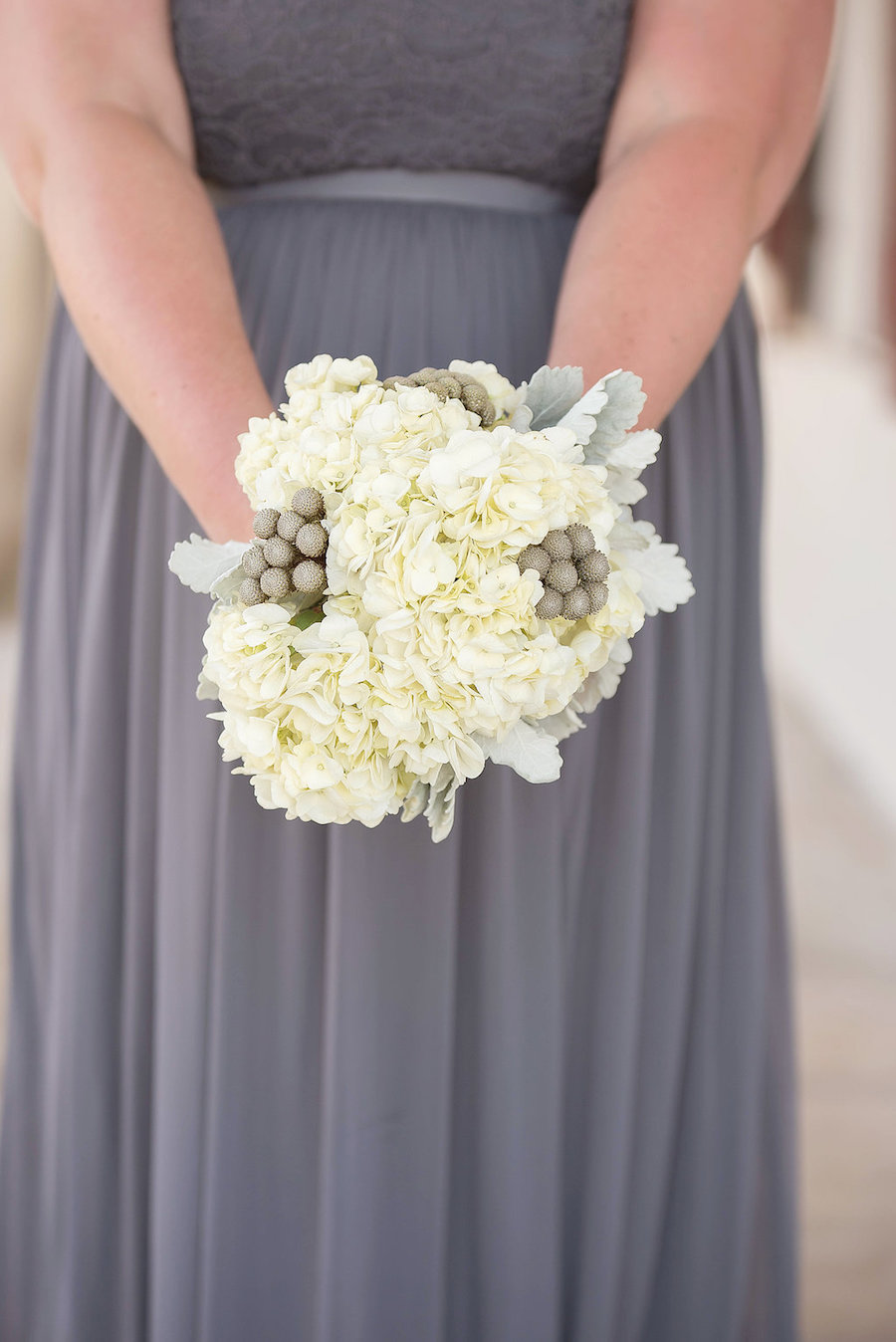 Grey Chiffon and Lace Bridesmaid Dress with White Hydrangea Wedding Bouquet with Dusty Miller and Hypericum Berries