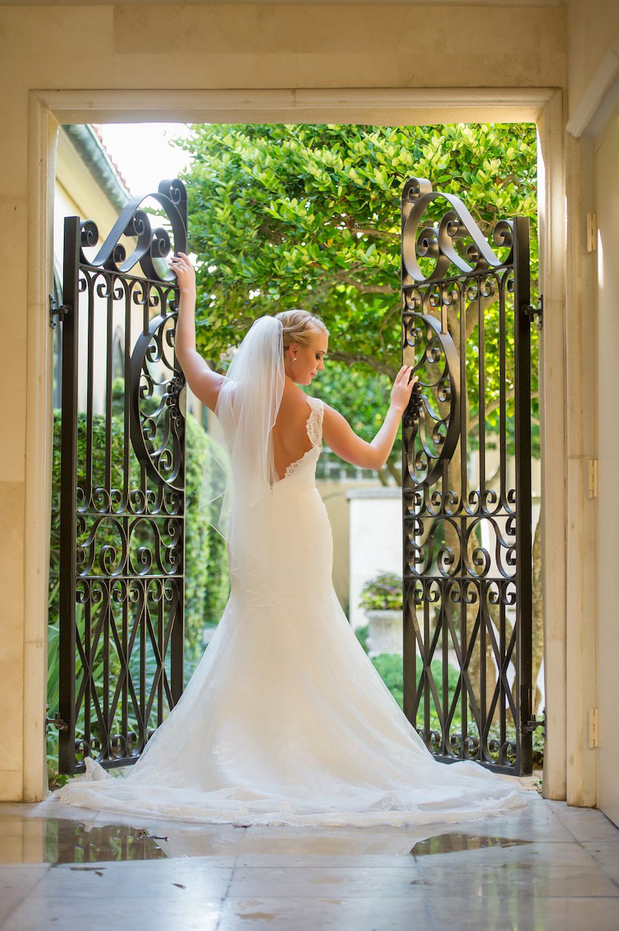 Bridal Wedding Portrait in White Open Back Lace Wedding Dress Against Rod Iron Gate at Palma Ceia Country Club | Tampa Bay Wedding Photography Andi Diamond Photography