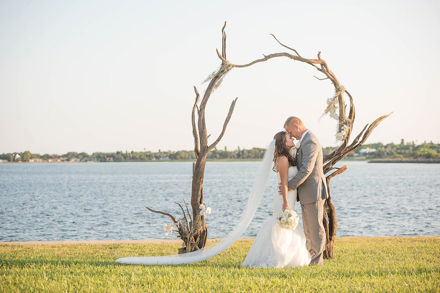 Florida Bride and Groom Wedding Portrait Under Beachwood Wedding Arch | St. Petersburg Wedding Photographer Kristen Marie Photography
