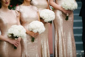 Bridesmaids in Gold Sequin Gowns with Ivory Rose Bouquets at St. Pete Beach Wedding Ceremony | St. Petersburg Wedding Venue The Don CeSar | Tampa Bay Wedding Photographer Jonathan Fanning Studio and Gallery