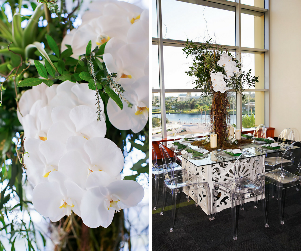 White Orchid Centerpiece with Twigs and Greenery | White Geometric Square Glass Table with Clear Ghost Chairs | Rental and Decor Company A Chair Affair | Downtown Tampa Venue Glazer's Children Museum