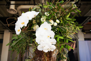 White Orchid Centerpiece with Twigs and Greenery | Modern Greenery Inspired Indoor Garden Wedding