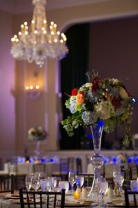 Classic Wedding Reception with Crystal Chandelier and Ivory, Blue and Cranberry Centerpieces in Tall Glass Vase | Tampa Wedding Photographer Andi Diamond Photography