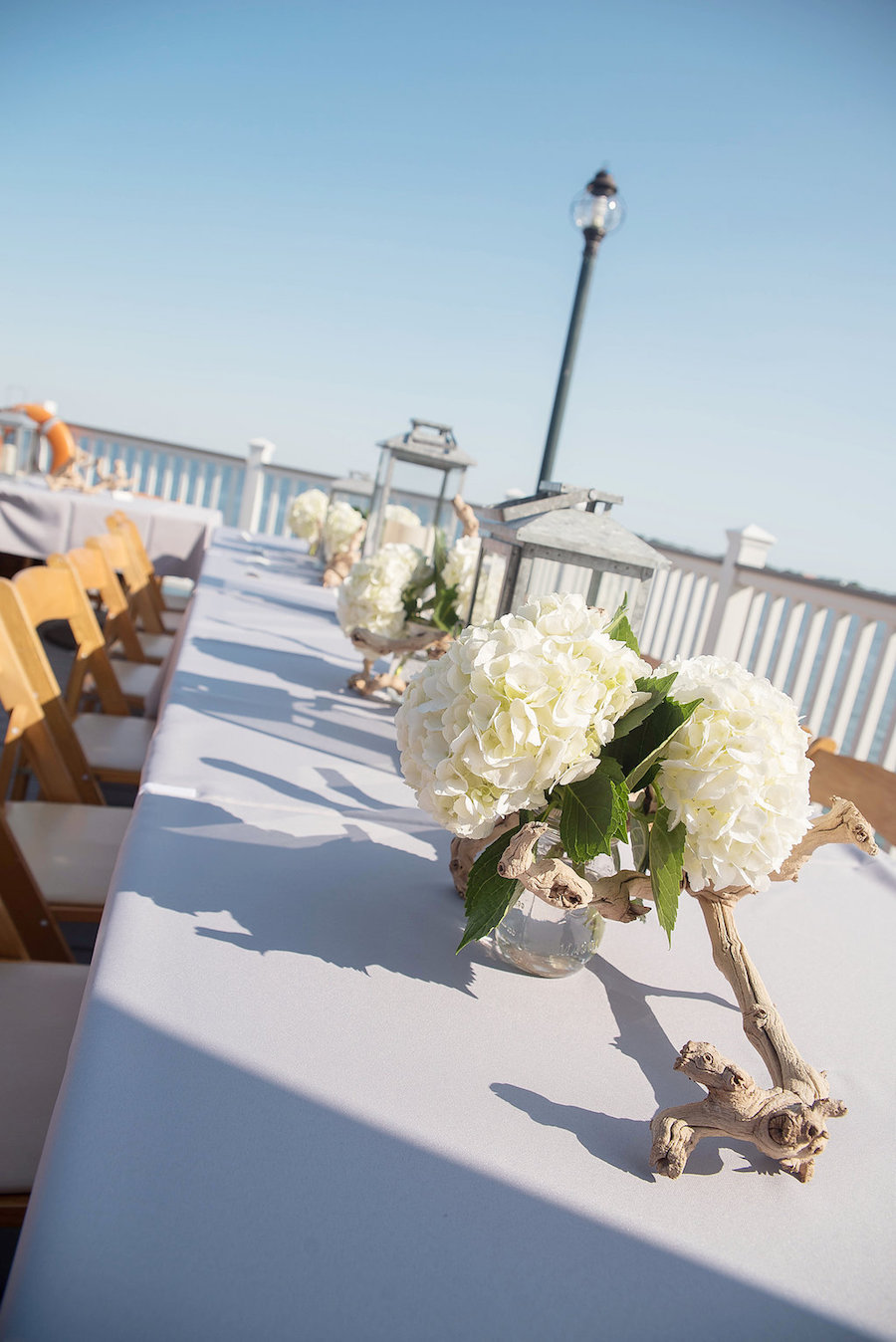 Outdoor Wedding Reception Decor with Ivory Hydrangeas and Beachwood/Driftwood Wedding Centerpieces