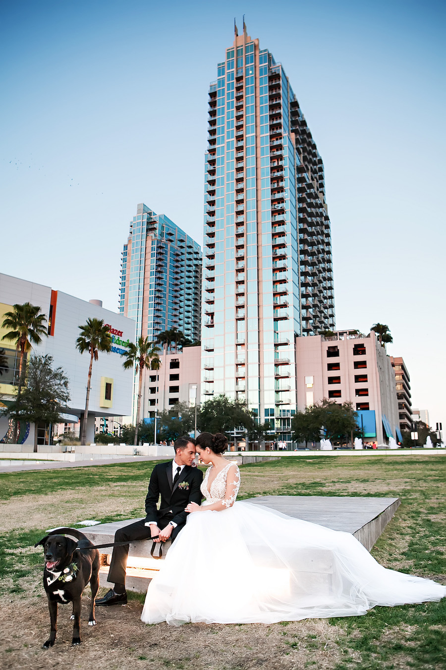Bride and Groom Downtown Tampa Wedding Portrait with Dog in Tuxedo with Floral Collar | Tampa Bay Wedding Pet Planner Fairytail Pet Care | Wedding Photographer Limelight Photography