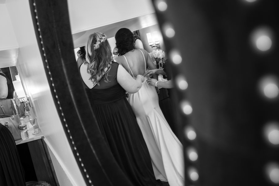 Bridal Getting Ready Wedding Day Portrait | Bride Putting On The Dress With Bridesmaids