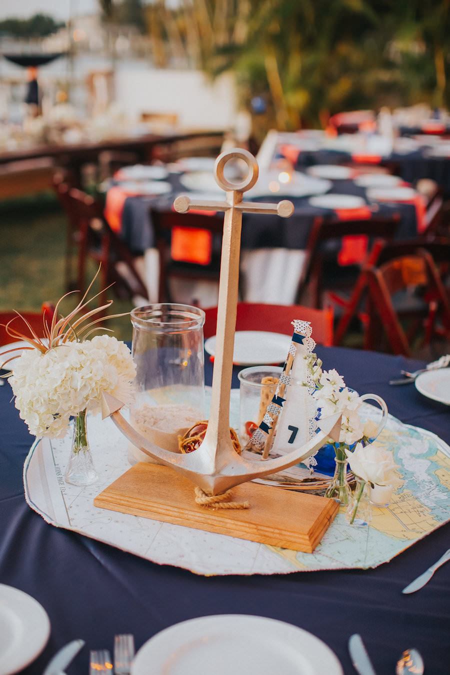Tampa Outdoor Waterfront Wedding Reception Decor with Nautical Anchor Table Decorations with Globes, Anchors and Navy and Red Linens