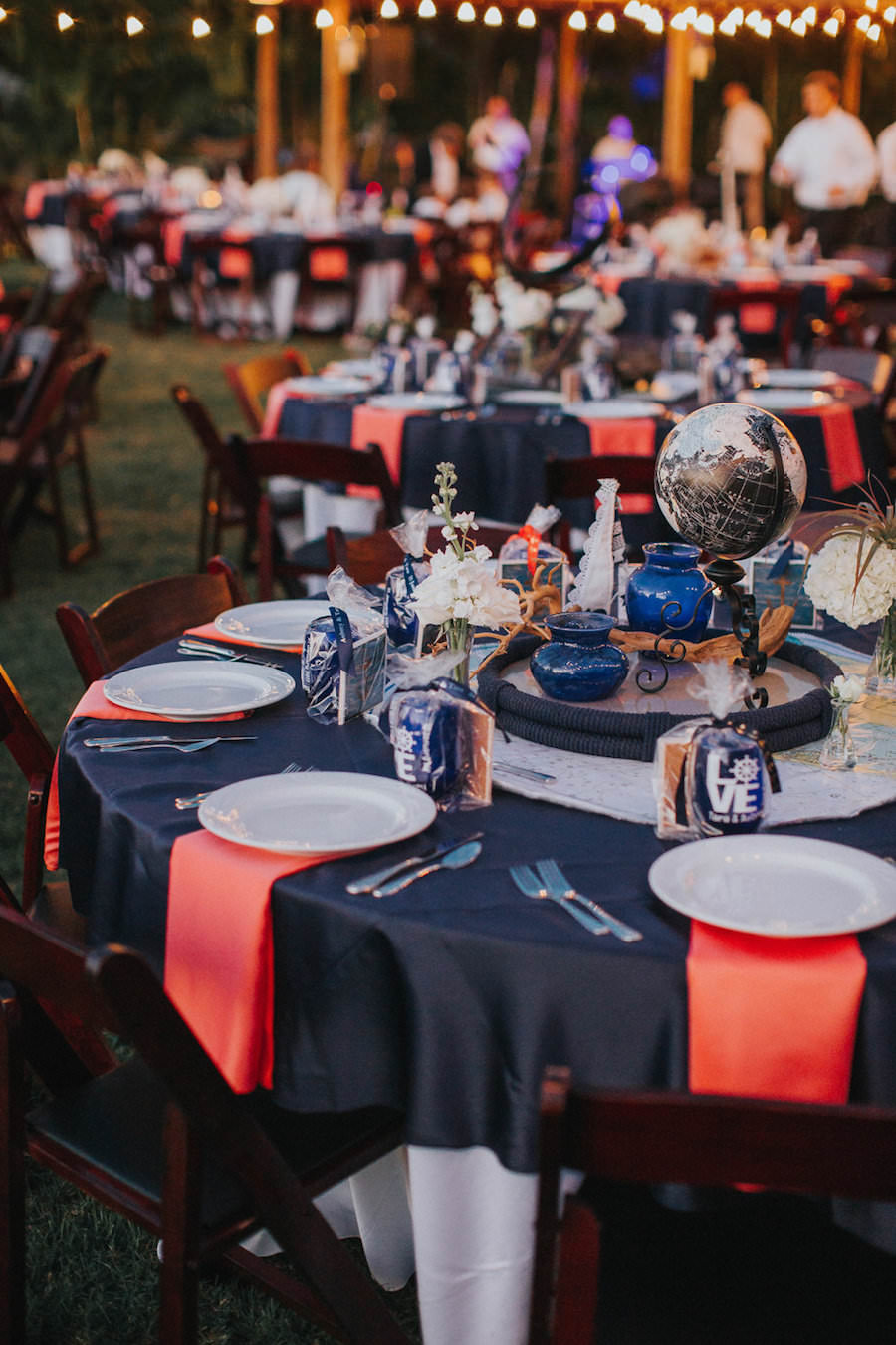 Tampa Outdoor Waterfront Wedding Reception Decor with Nautical Anchor Table Decorations with Globes, Anchors and Navy and Red Linens