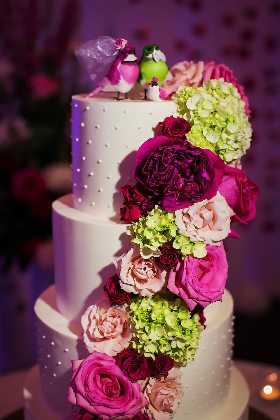 Four Tier Round White Wedding Cake with Pink and Green Roses and Hydrangea with Bird Wedding Cake Topper | Sarasota Wedding Photography by Limelight Photography
