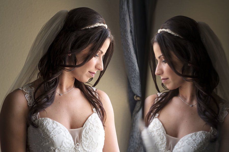 Getting Ready: Bride in Ivory Beaded Gown With Veil Looking in Mirror Wedding Portrait | Tampa Bay Wedding Photographer Marc Edwards Photographs
