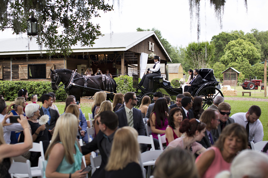 Outdoor Wedding Ceremony Horse and Carriage Bridal Entrance | Tampa Bay Wedding Venue Cross Creek Ranch | Tampa Bay Wedding Photographer Djamel Photography