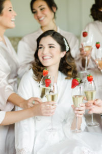 Getting Ready Bride and Bridesmaids Drinking Champagne | St. Petersburg Wedding Venue The Birchwood | Tampa Bay Wedding Photographer Ailyn La Torre Photography