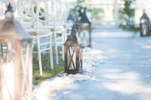 Outdoor Wedding Ceremony Brown Lantern with Candle Aisle Decor and Vintage White Wooden Chairs | Tampa Wedding Photographer Kera Photography