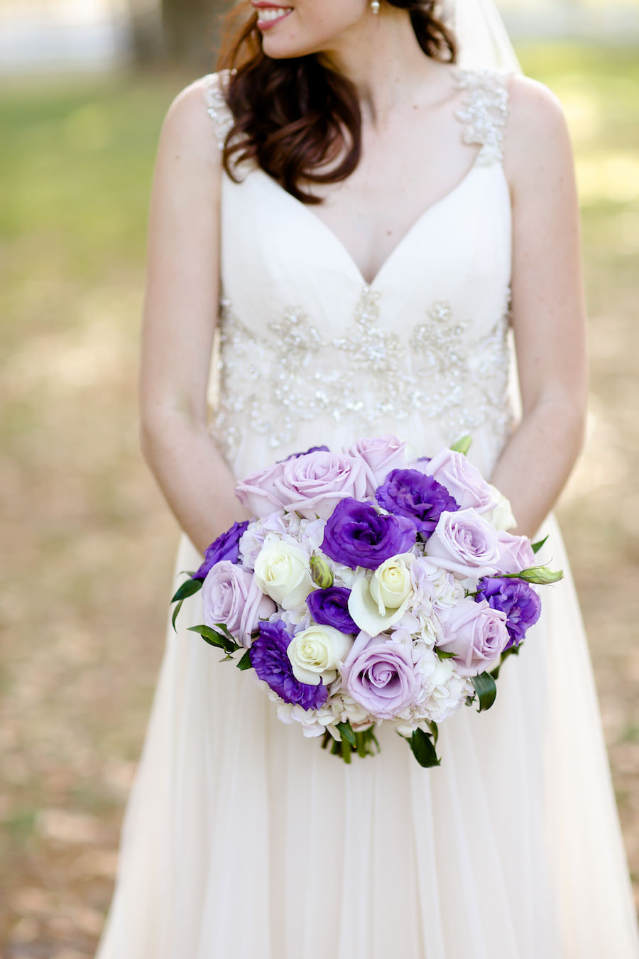 Outdoor Bridal Wedding Portrait in Maggie Sottero Wedding Dress at Tampa Bay Wedding Venue The Lange Farm | Purple, Ivory and Lilac Roses Bridal Wedding Bouquet | Tampa Wedding Florist Northside Florist