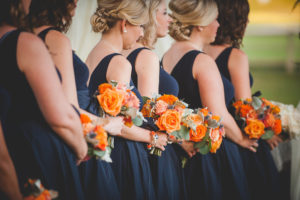 Navy Blue Bridesmaids Bridal Party Wedding Ceremony Portrait | Short Navy Blue Bloomingdale's Bridesmaids Dresses with Pearls and Bright Orange and Green Bouquets | Dade CIty Wedding Venue The Lange Farm