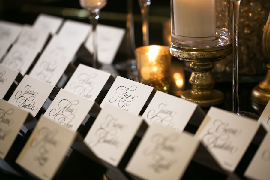 Gold, Black and White Wedding Reception Calligraphy Placecard Table | Modern Elegant Downtown Tampa Wedding Venue The Tampa Club | Tampa Bay Wedding Photographer Carrie Wildes Photography | Wedding Stationery A & P Designs